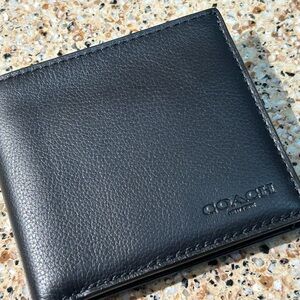 Coach Black Leather bi fold men’s wallet.
